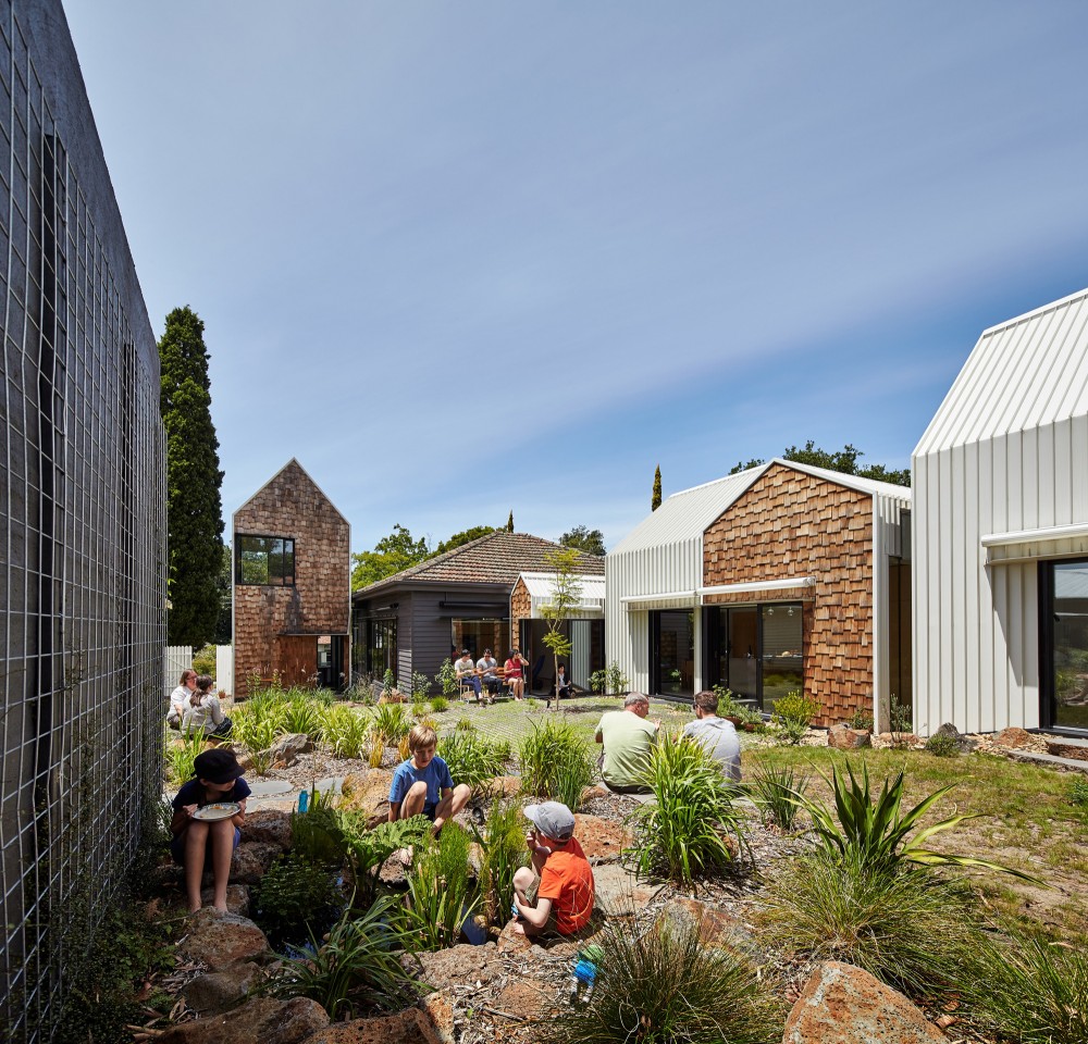 A series of smaller-scale structures create a sense of community at Tower House